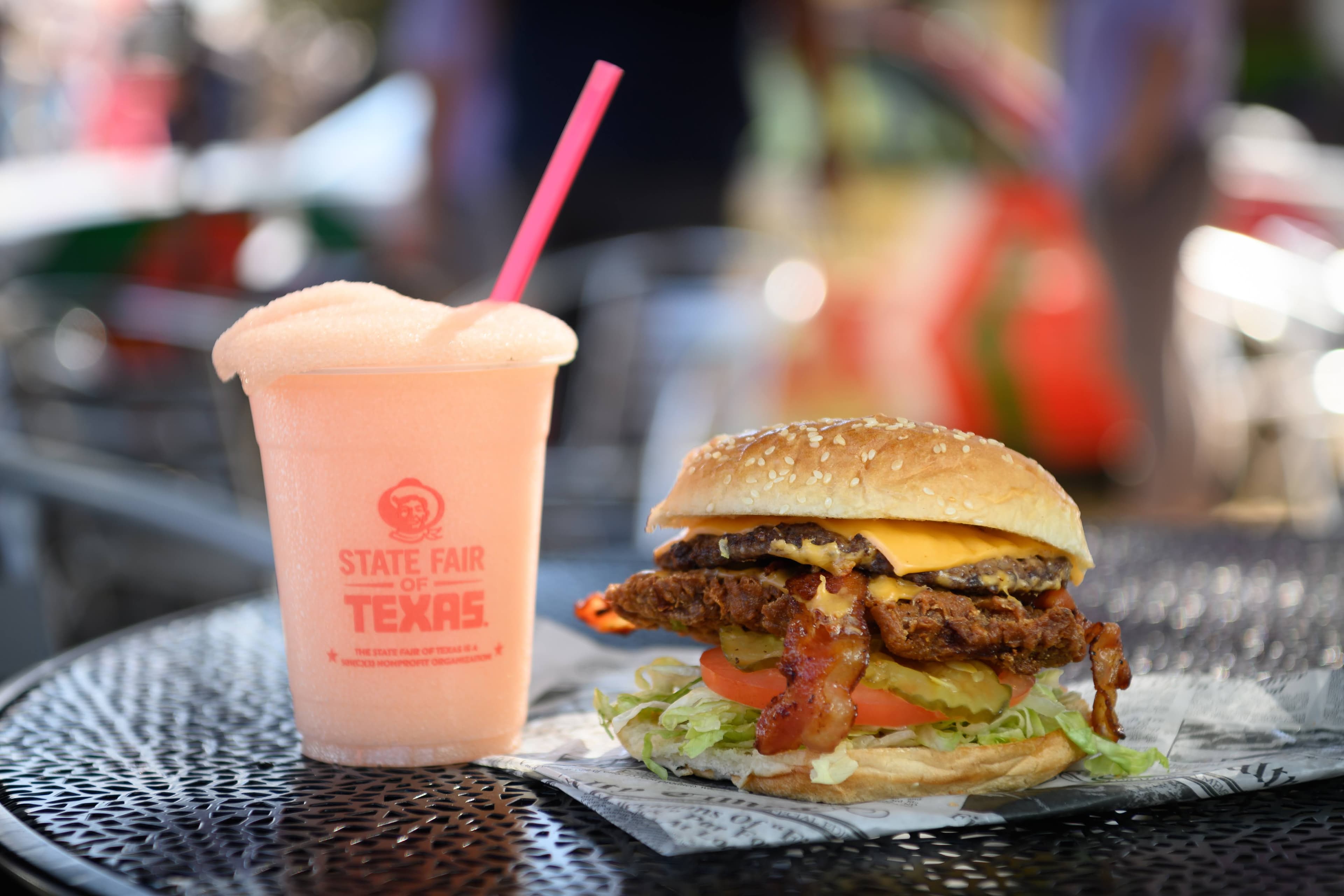 File photo: A burger and a pale pink drink sit on an outdoor table. This archival image does not depict a new 2026 menu item.